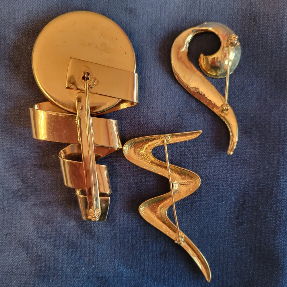 Trifari trio brooches